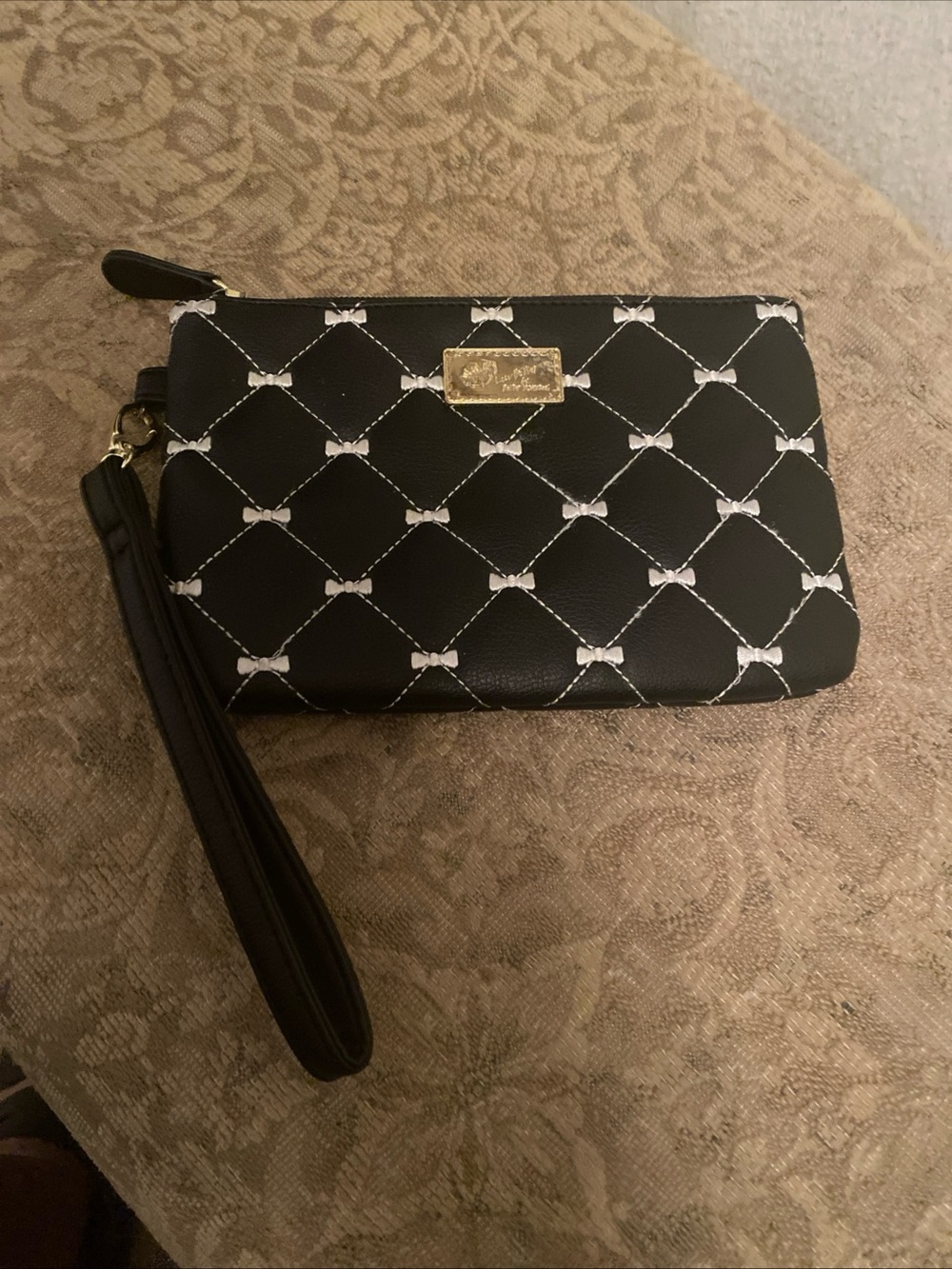 Betsey Johnson Black Quilted Bow-Print Wristlet with Gold Plaque